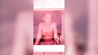 Wife stripping it off in the window for all to see